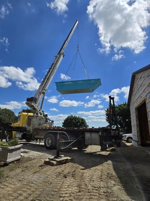 Crane Lifting A Fiberglass Pool Into Place In Kitchener, ON (2)