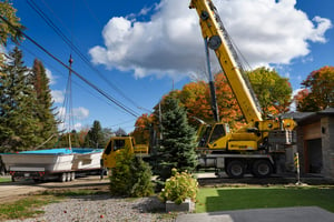 Crane lifting fiberglass pool