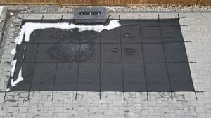 drone shot of winter safety pool cover
