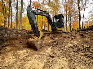 Excavator digging for an inground swimming pool in Kitchener-Waterloo