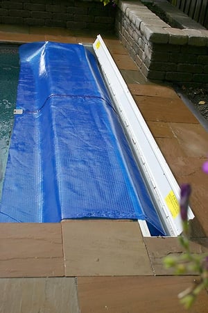 Cleardeck inground solar blanket roller on a latham fiberglass pool