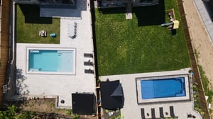 Two inground pools installed by Hipel Pools In Kitchener, ON